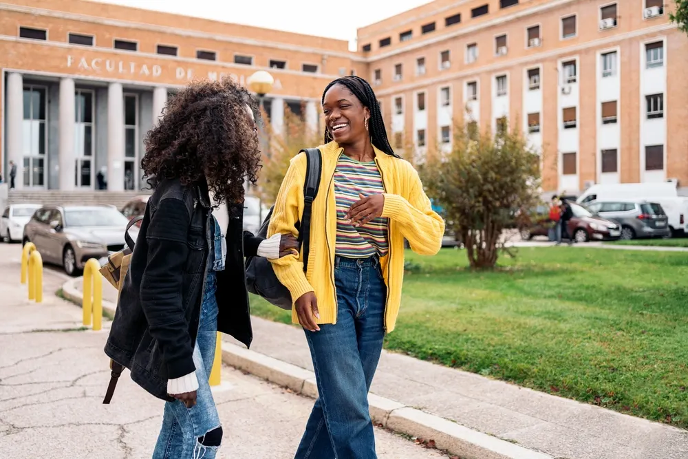College students walking and studying on a university campus